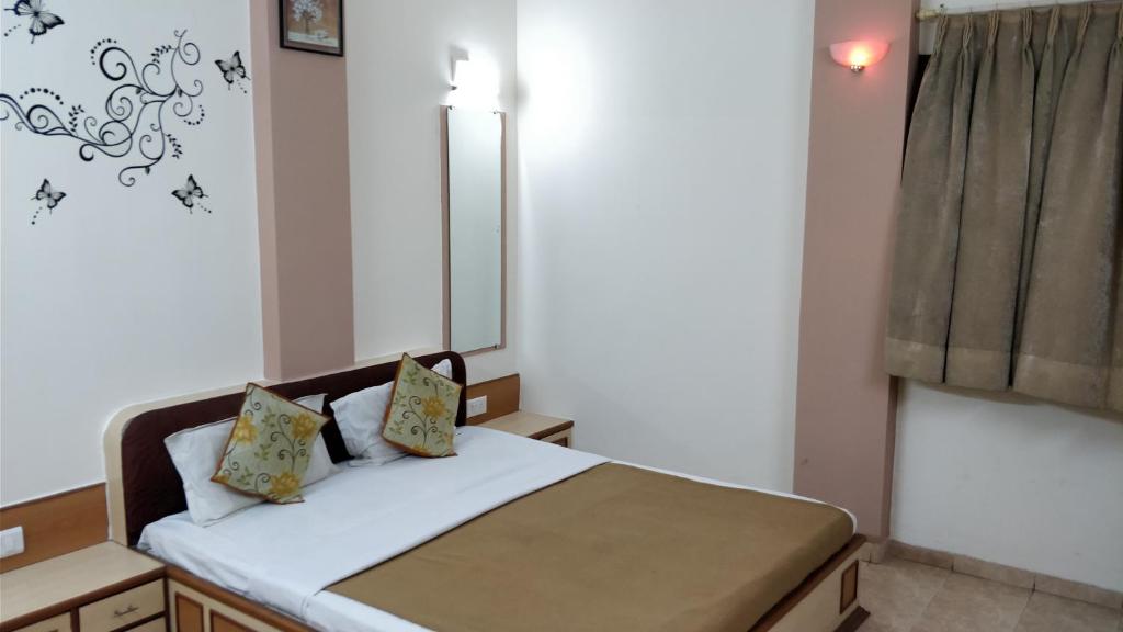 Postel nebo postele na pokoji v ubytování Hotel Damjis
