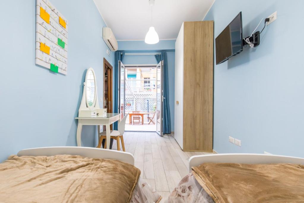 Postel nebo postele na pokoji v ubytování B&b Il miglio d’oro