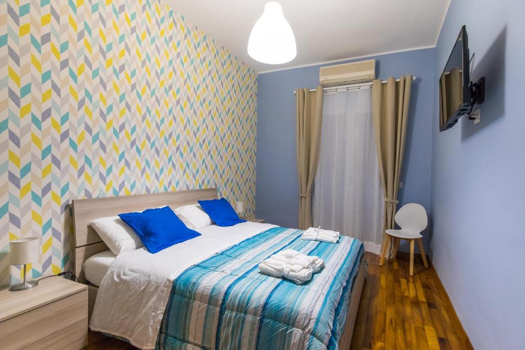Postel nebo postele na pokoji v ubytování B&b Il miglio d’oro