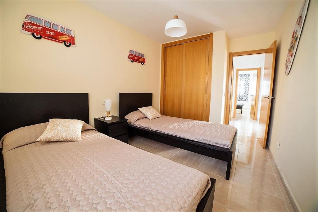 Posteľ alebo postele v izbe v ubytovaní Residencial La Perla