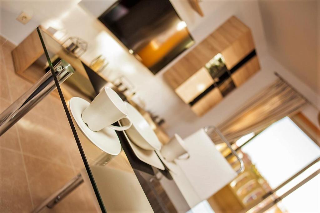 Televízia a/alebo spoločenská miestnosť v ubytovaní Residencial La Perla