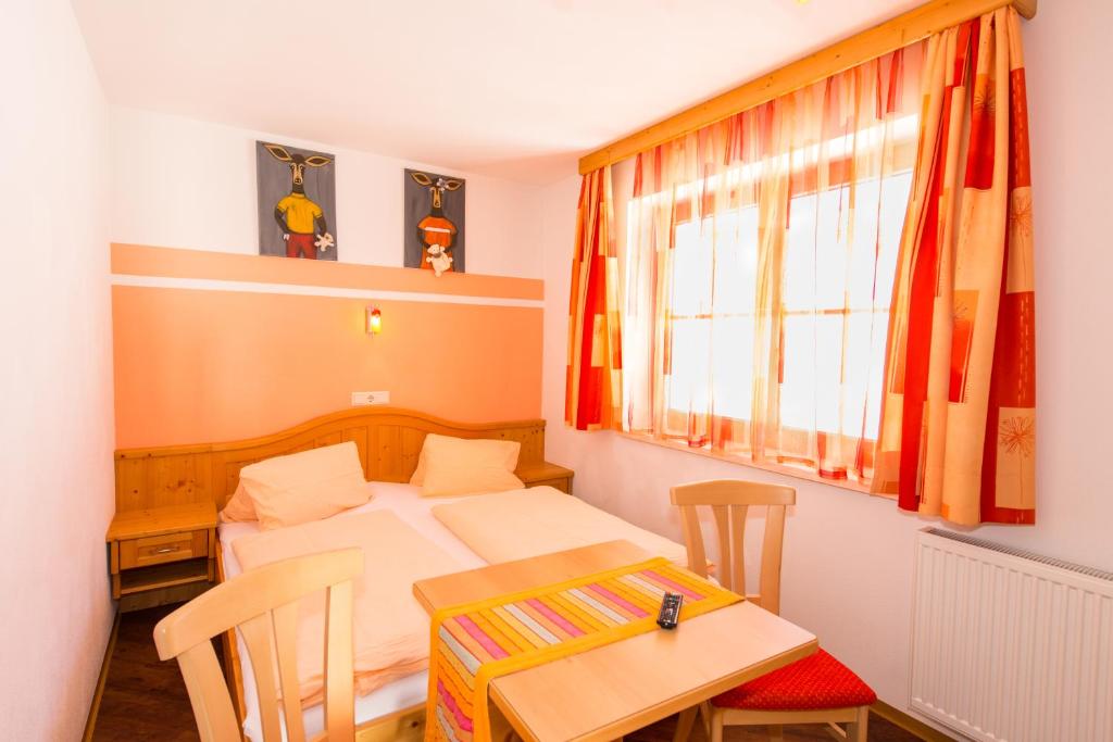 A bed or beds in a room at Maria's Sonnenquartier