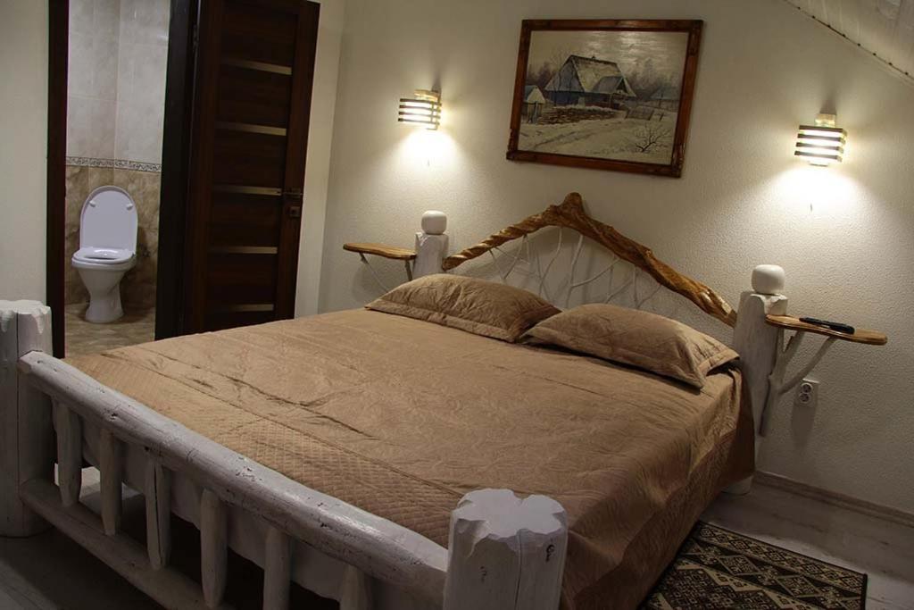 Postel nebo postele na pokoji v ubytování Cottage "Pyate Koleso"