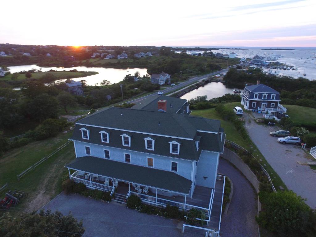 an aerial view of a large house and the ocean at Payne's Harbor View Inn in New Shoreham