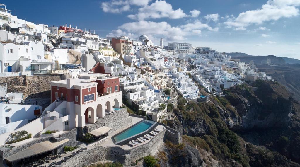 a view of a village on the side of a mountain at Villa Bordeaux in Fira