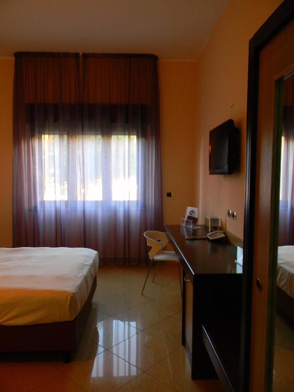 Postel nebo postele na pokoji v ubytování Grand Hotel Paradiso