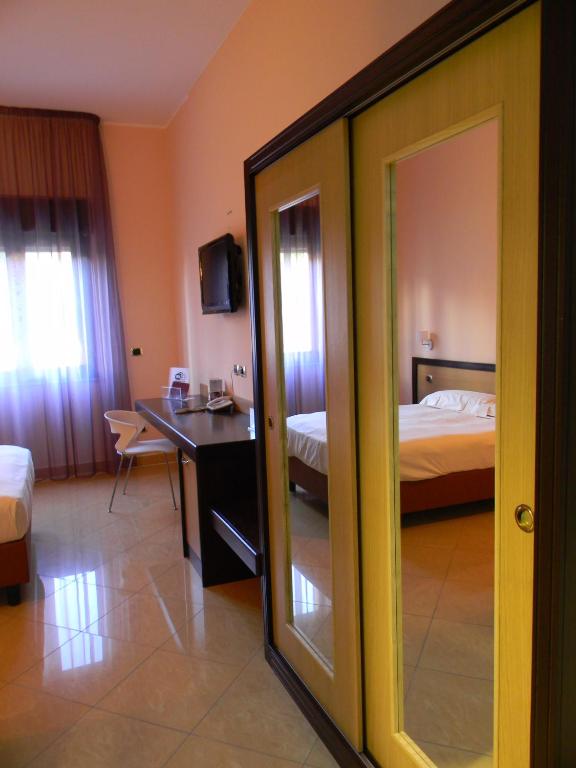 Postel nebo postele na pokoji v ubytování Grand Hotel Paradiso