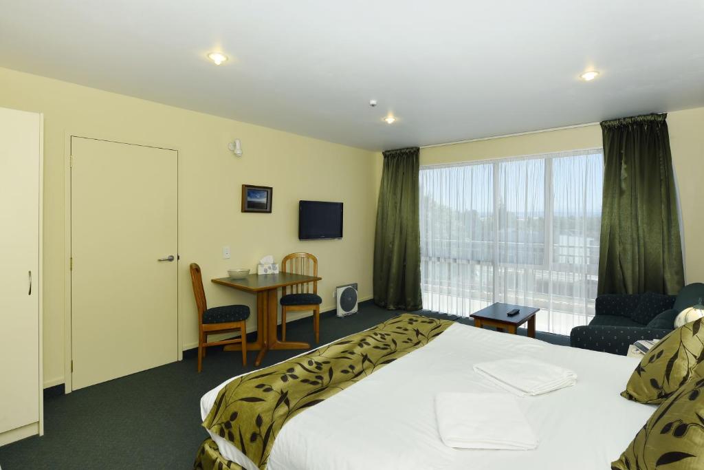 Postel nebo postele na pokoji v ubytování Abelia Motor Lodge
