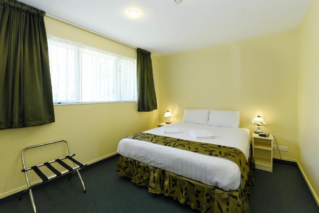 Postel nebo postele na pokoji v ubytování Abelia Motor Lodge