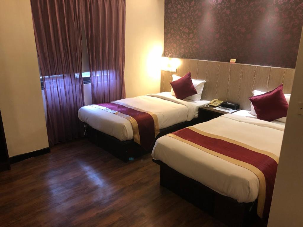 Postel nebo postele na pokoji v ubytování Zhao Lai Hotel