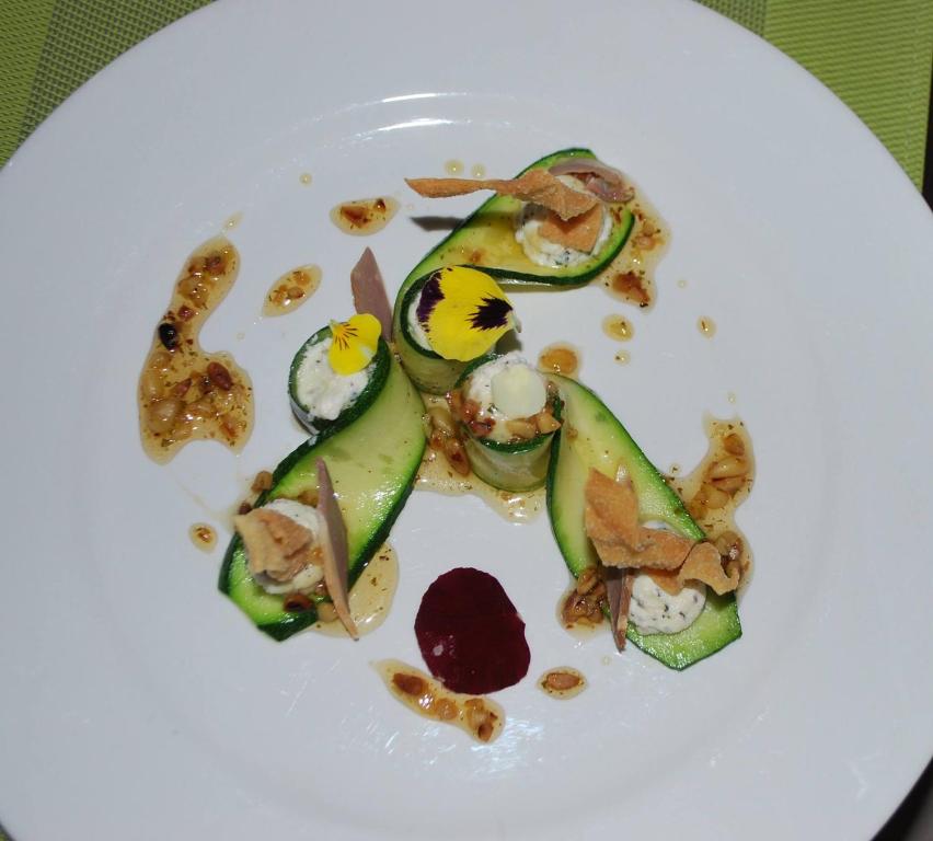 a white plate with some food on it at Hotel le Corbusier in Marseille