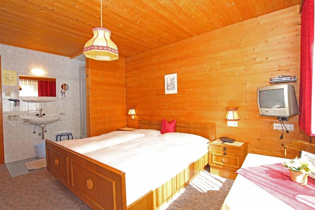 Postel nebo postele na pokoji v ubytování Pension Delacher