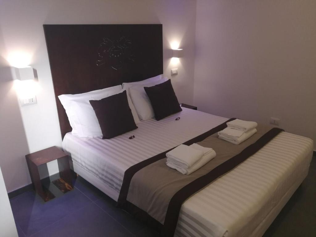 Postel nebo postele na pokoji v ubytování Hotel Assisivm Antica Dimora AD