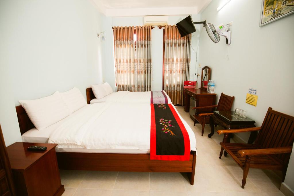 Postel nebo postele na pokoji v ubytování Binh An hotel