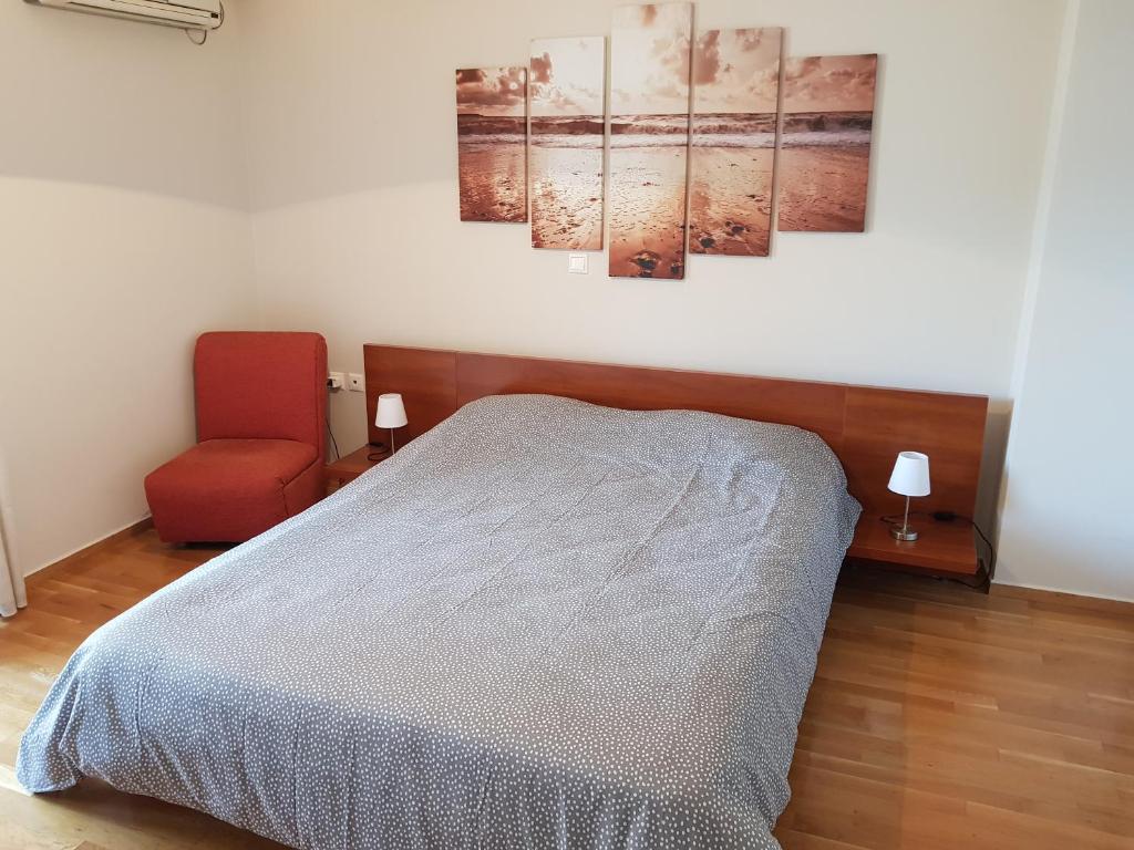 Postel nebo postele na pokoji v ubytování Holargos Metro Rooms