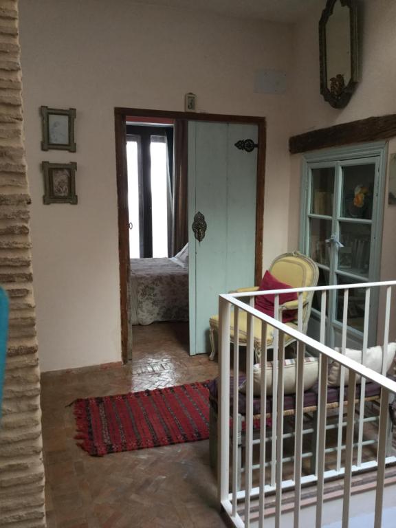 Posteľ alebo postele v izbe v ubytovaní Hostal Casa Del Buen Viaje