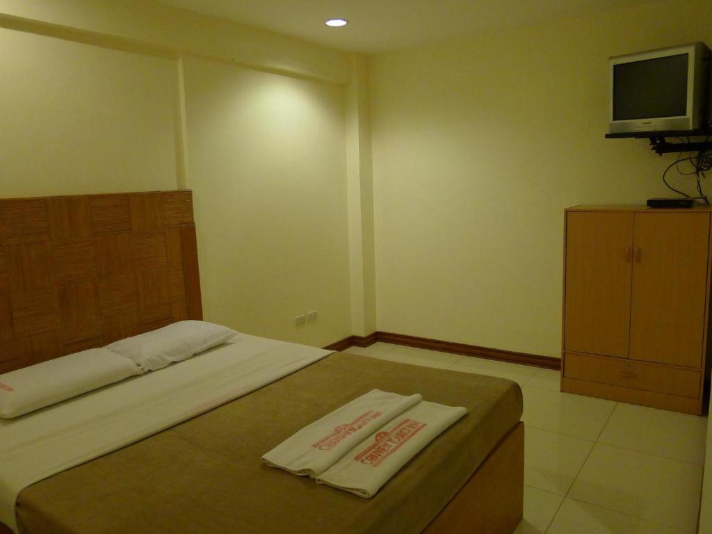 Postel nebo postele na pokoji v ubytování Cebuview Tourist Inn
