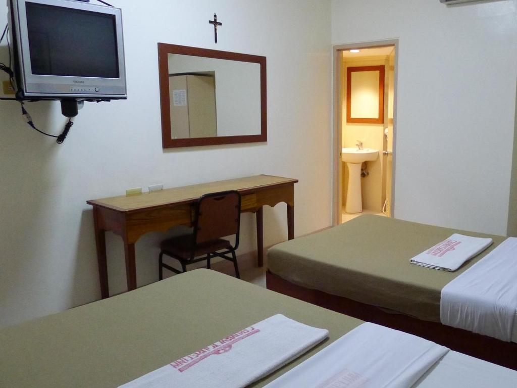 Postel nebo postele na pokoji v ubytování Cebuview Tourist Inn
