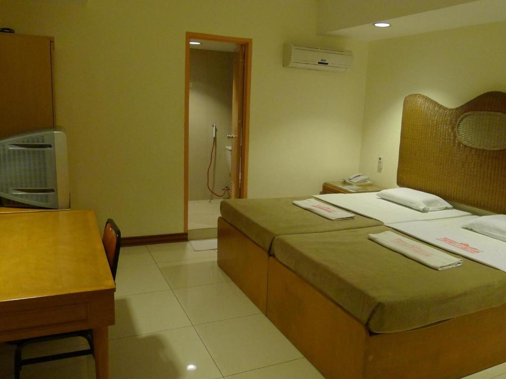 Postel nebo postele na pokoji v ubytování Cebuview Tourist Inn