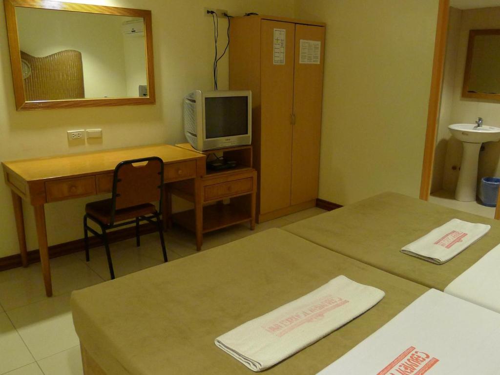 Postel nebo postele na pokoji v ubytování Cebuview Tourist Inn