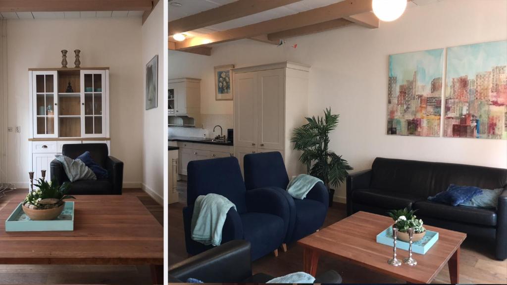een woonkamer met een bank en een tafel bij aan Hooger Wal in Vlissingen