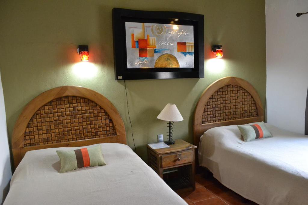 מיטה או מיטות בחדר ב-La Ventana del Tepozteco