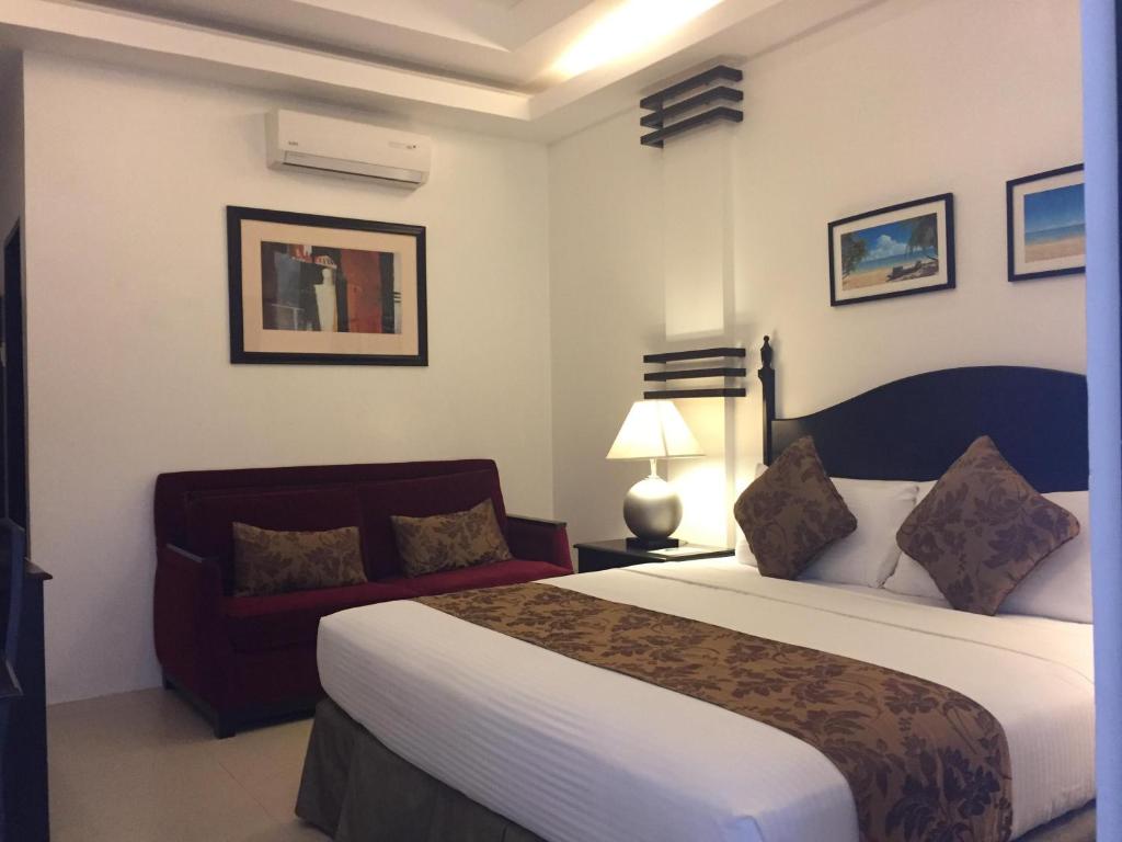 Postel nebo postele na pokoji v ubytování Chateau De Boracay