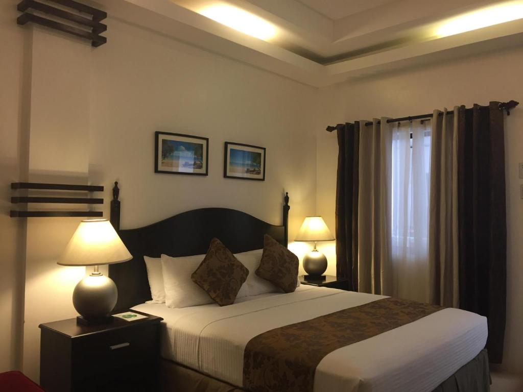 Postel nebo postele na pokoji v ubytování Chateau De Boracay