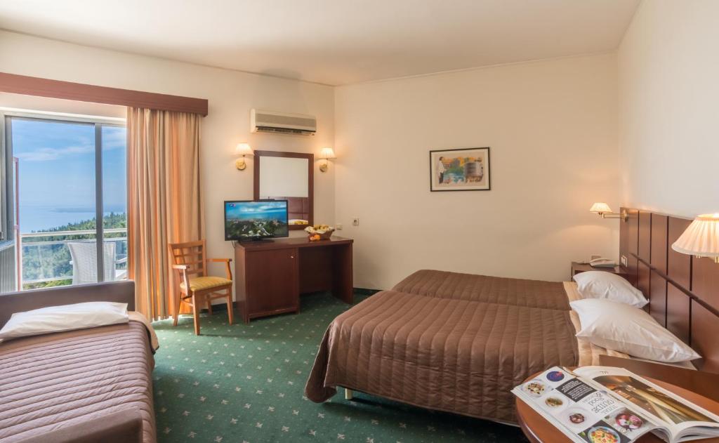 A bed or beds in a room at Philippion