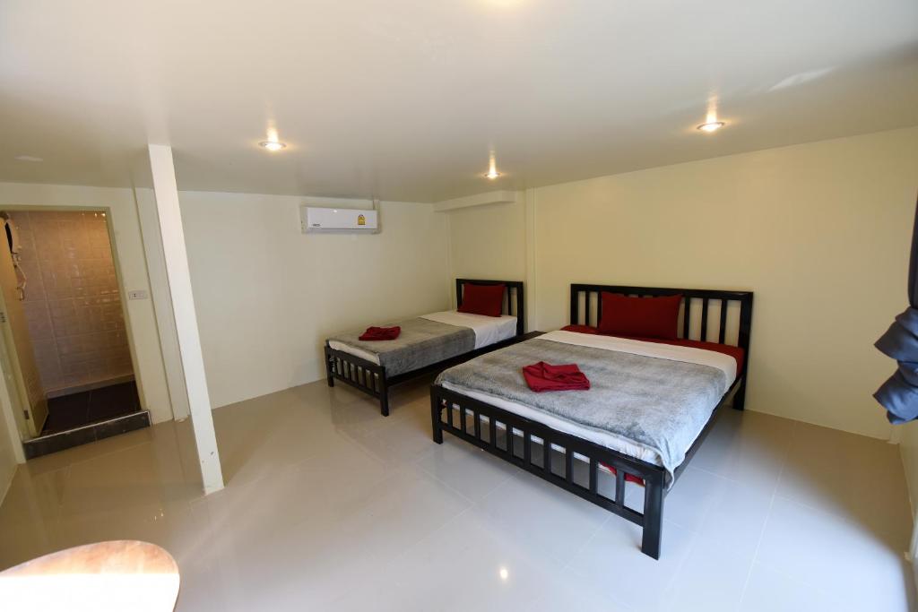 Postel nebo postele na pokoji v ubytování Kitty Guesthouse