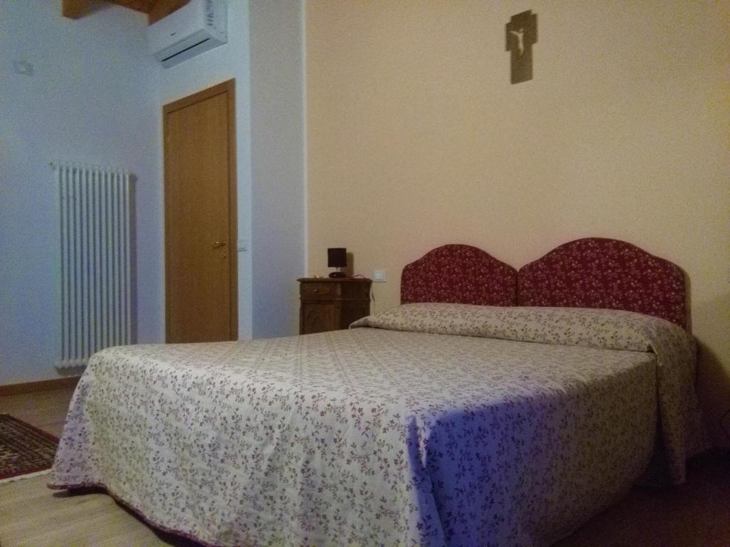 Posteľ alebo postele v izbe v ubytovaní B&B Paradiso