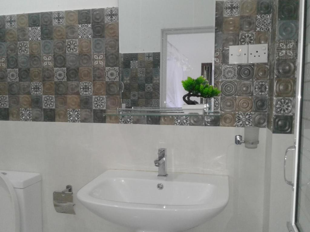 Koupelna v ubytování Apna Homestay Apartments