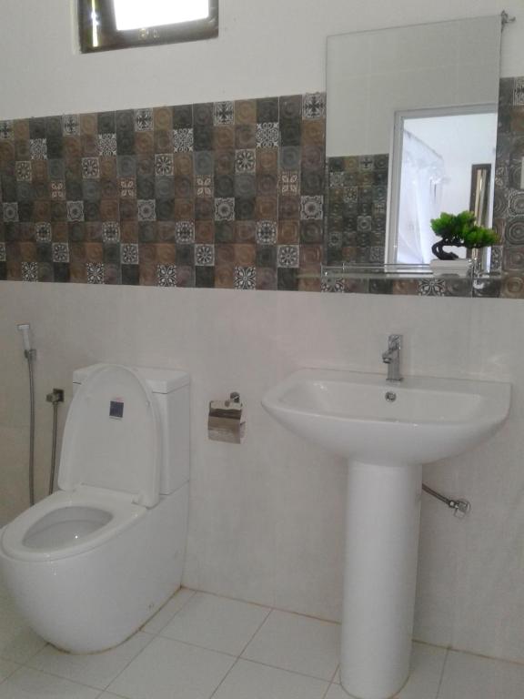 Koupelna v ubytování Apna Homestay Apartments