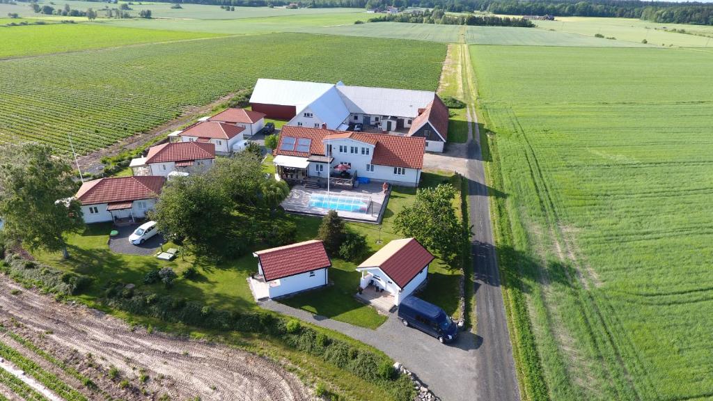 an aerial view of a house in the middle of a field at Nordanå Gård in Strö