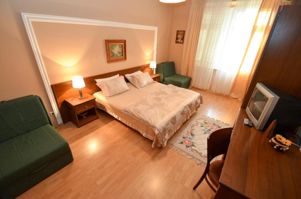 Postel nebo postele na pokoji v ubytování Apartments Vojin