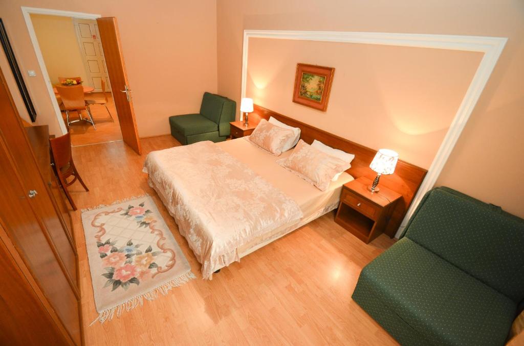 Postel nebo postele na pokoji v ubytování Apartments Vojin