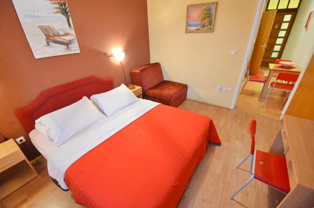 Postel nebo postele na pokoji v ubytování Apartments Vojin