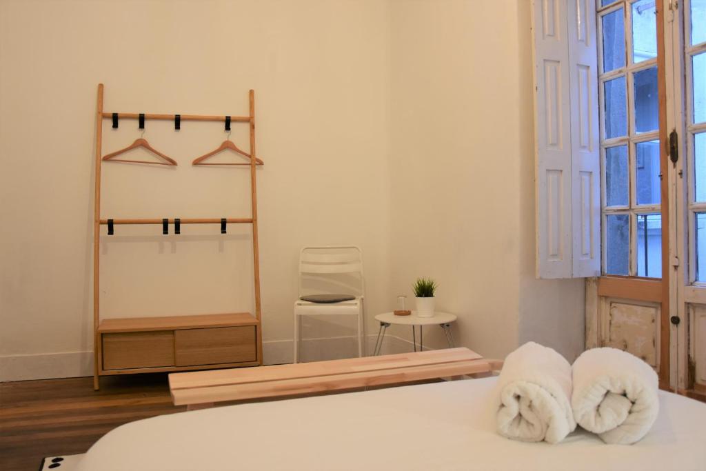 Posteľ alebo postele v izbe v ubytovaní Slow City Hostel Pontevedra