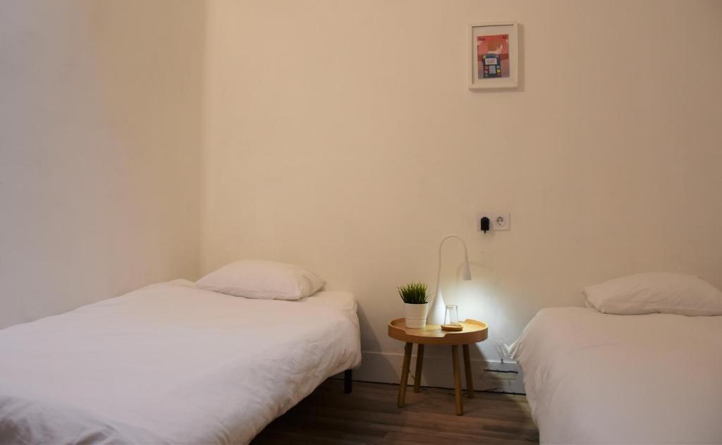 Posteľ alebo postele v izbe v ubytovaní Slow City Hostel Pontevedra