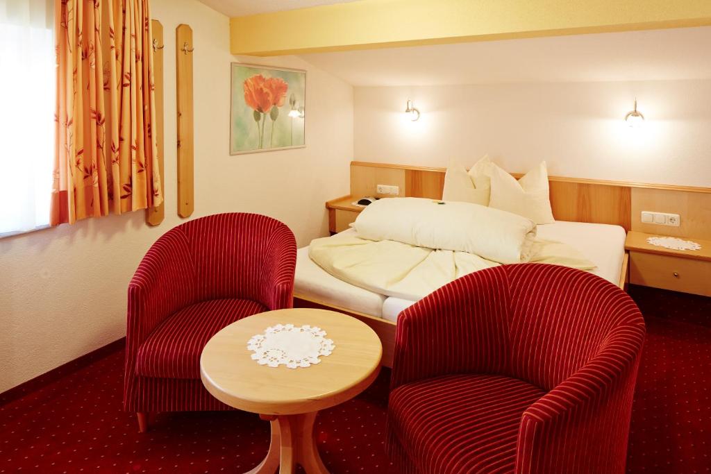 Postel nebo postele na pokoji v ubytování Hotel Garni Panorama