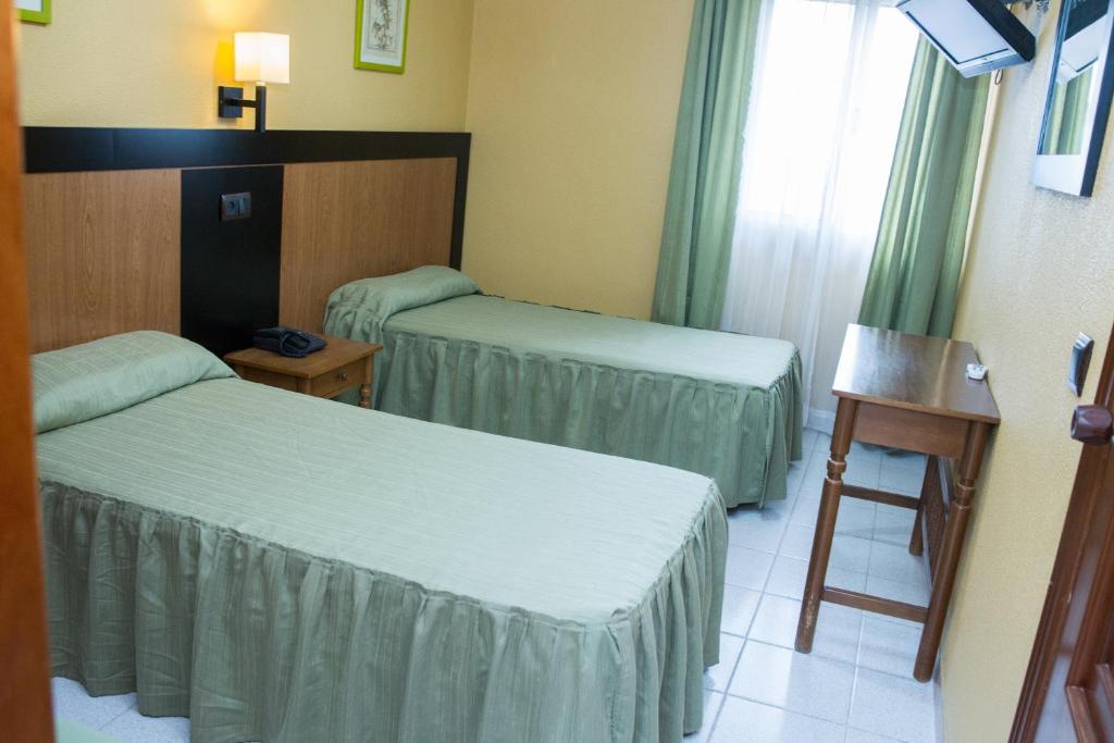 Posteľ alebo postele v izbe v ubytovaní Hostelería La Palmera De Miajadas SL