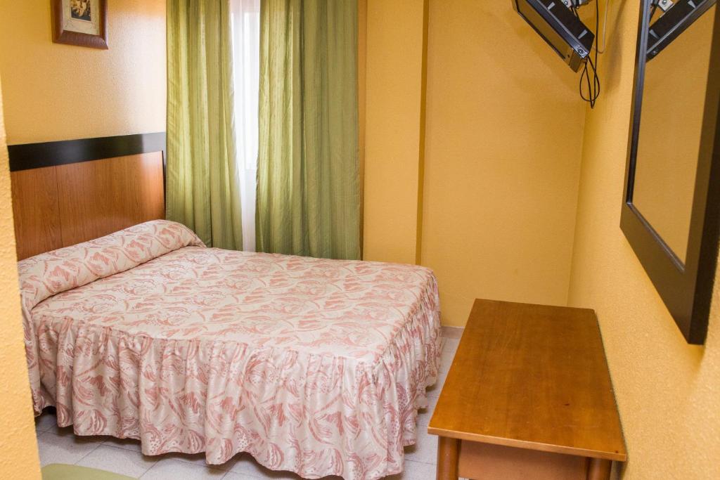 Posteľ alebo postele v izbe v ubytovaní Hostelería La Palmera De Miajadas SL