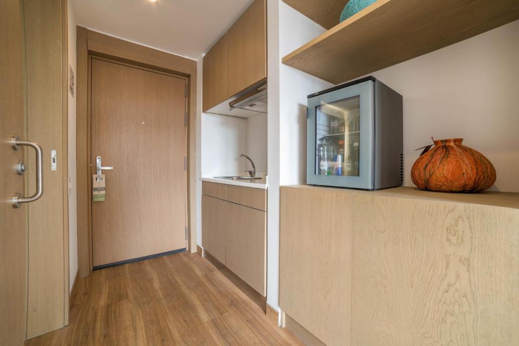 Kuchyň nebo kuchyňský kout v ubytování Biohotel Organic Suites