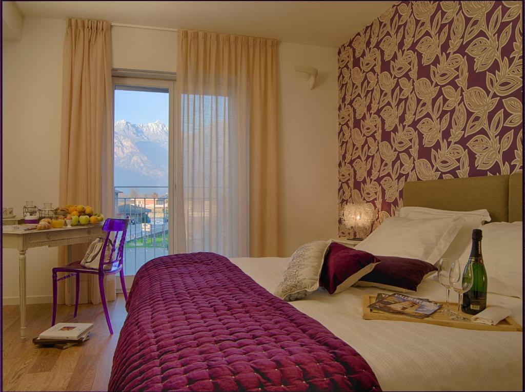 Postel nebo postele na pokoji v ubytování Spluga Sosta & Hotel
