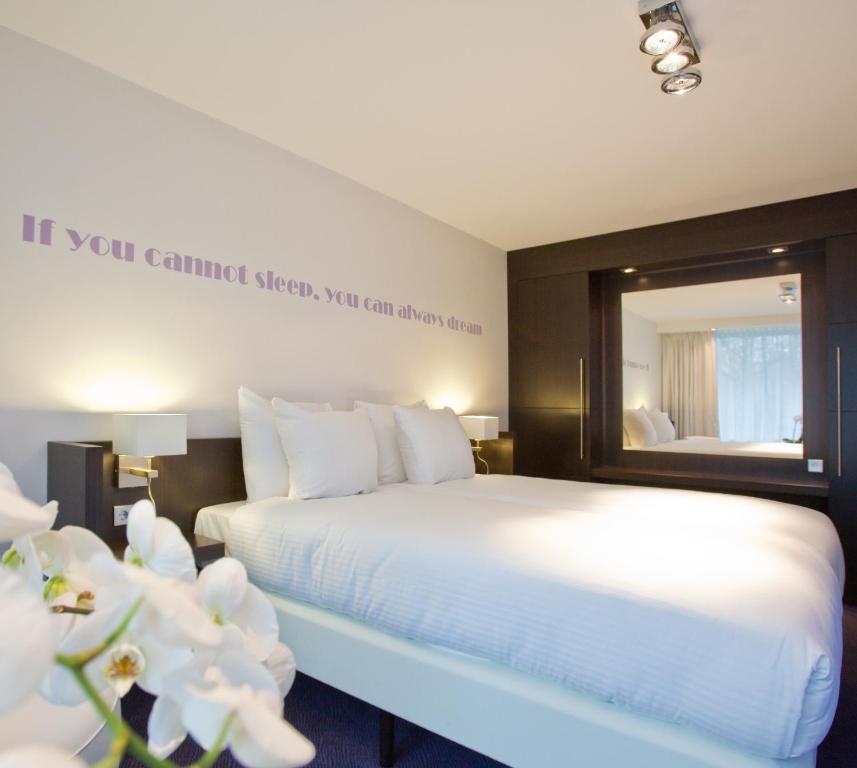 Postel nebo postele na pokoji v ubytování Van der Valk Hotel Assen