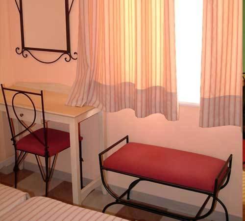 Postel nebo postele na pokoji v ubytování Apartamentos Villa de Noja