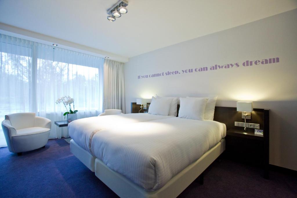 Postel nebo postele na pokoji v ubytování Van der Valk Hotel Assen