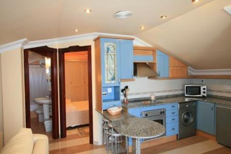 Kuchyň nebo kuchyňský kout v ubytování Apartamentos Villa de Noja