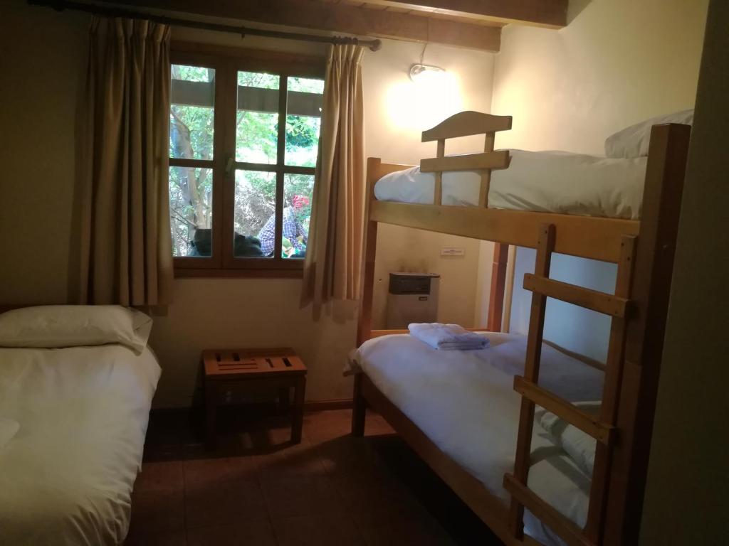 Postel nebo postele na pokoji v ubytování Cabañas La Encantada