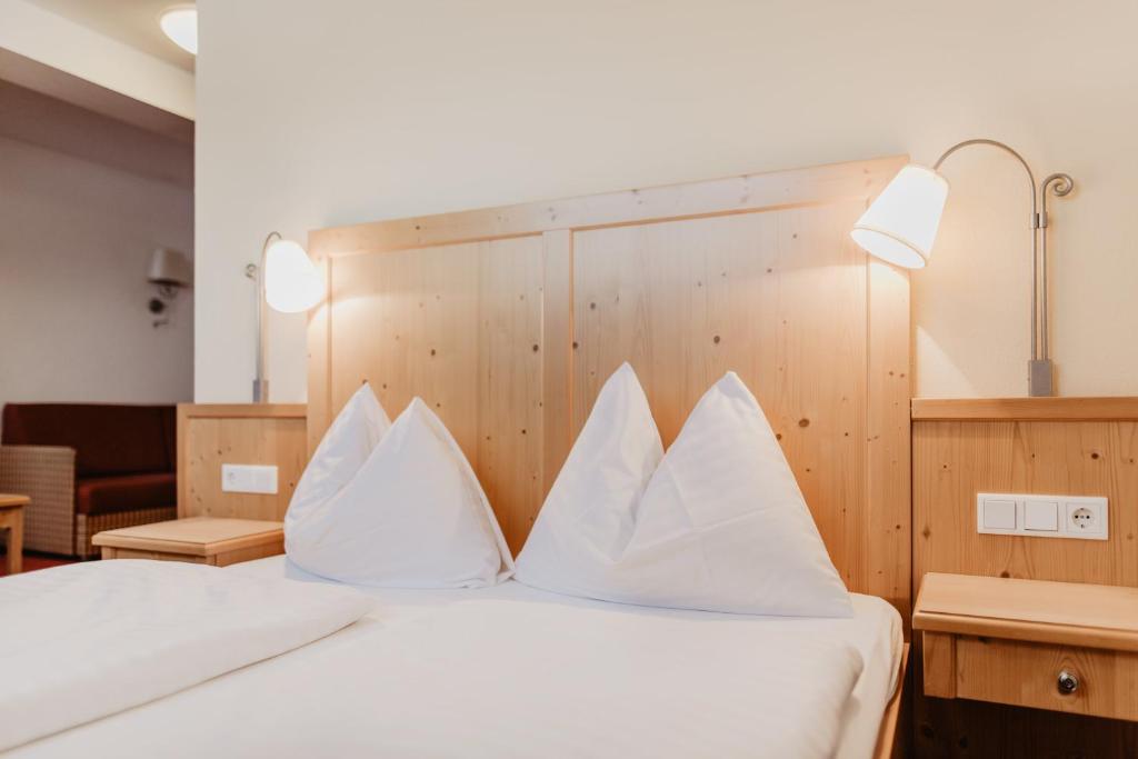Postel nebo postele na pokoji v ubytování Hotel Restaurant tauernhex